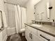 A simple bathroom with a shower-tub combo with a white shower curtain at 12508 Asbury Chapel Rd, Huntersville, NC 28078