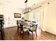 Bright dining room with a round table, modern light fixture, and access to outdoor patio at 12508 Asbury Chapel Rd, Huntersville, NC 28078