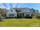 Charming single-Gathering home features a well-manicured lawn and inviting front porch at 12508 Asbury Chapel Rd, Huntersville, NC 28078