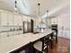 Bright kitchen boasts an oversized island with seating, sleek stainless appliances, and modern lighting at 12508 Asbury Chapel Rd, Huntersville, NC 28078