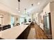 Bright kitchen with island, stainless steel appliances, and open floor plan at 12508 Asbury Chapel Rd, Huntersville, NC 28078