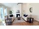 Inviting living room with fireplace, hardwood floors, and comfortable seating at 12508 Asbury Chapel Rd, Huntersville, NC 28078