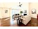 Bright living room with fireplace, hardwood floors, comfortable seating, and natural light at 12508 Asbury Chapel Rd, Huntersville, NC 28078