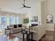 Bright and airy living room with a fireplace, hardwood flooring, and neutral-colored furniture at 12508 Asbury Chapel Rd, Huntersville, NC 28078