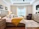 Spacious main bedroom with hardwood floors, tray ceiling, and ample natural light at 12508 Asbury Chapel Rd, Huntersville, NC 28078