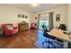 Home office features hardwood floors, natural light, and functional workspace at 12508 Asbury Chapel Rd, Huntersville, NC 28078