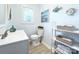 Bathroom features white fixtures, a modern vanity, and charming decor at 1304 S Main St, Mount Holly, NC 28120