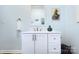 Bathroom vanity featuring modern fixtures, decorative artwork, and ample storage space at 1304 S Main St, Mount Holly, NC 28120