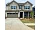Charming two-story home featuring a spacious two-car garage and beautifully landscaped front yard at 13729 Roderick Dr # 188, Huntersville, NC 28078