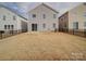 Spacious backyard featuring a well-maintained lawn and a charming patio area, perfect for outdoor relaxation at 15040 Cordelia Dr, Charlotte, NC 28278
