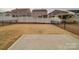 Expansive backyard featuring a concrete patio area and a fence, ideal for entertaining and outdoor activities at 15040 Cordelia Dr, Charlotte, NC 28278