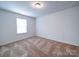 Bedroom featuring neutral walls and one window at 15040 Cordelia Dr, Charlotte, NC 28278