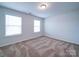 Bedroom featuring two windows at 15040 Cordelia Dr, Charlotte, NC 28278