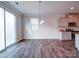 Bright dining area with hardwood floors, modern chandelier, and access to the kitchen at 15040 Cordelia Dr, Charlotte, NC 28278