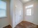 Welcoming foyer featuring hardwood floors, a closet for storage, and natural light at 15040 Cordelia Dr, Charlotte, NC 28278