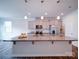 Well-lit kitchen with a granite island, stainless steel appliances, and hardwood floors at 15040 Cordelia Dr, Charlotte, NC 28278