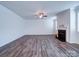 Bright living room featuring a fireplace, ceiling fan, and neutral walls at 15040 Cordelia Dr, Charlotte, NC 28278