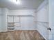 Spacious walk-in closet with multiple shelves and rods for storage at 15040 Cordelia Dr, Charlotte, NC 28278