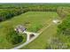 Aerial view showcases a home with lush green fields and ample land at 16160 Hopewell Church Rd, Midland, NC 28107