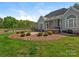 Enjoy outdoor living with a screened porch, hot tub, and lush backyard at 16160 Hopewell Church Rd, Midland, NC 28107