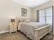 Bedroom featuring a white bed frame, neutral walls, carpet flooring and window with blinds at 16160 Hopewell Church Rd, Midland, NC 28107