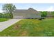 Charming home with a two-car garage, well-manicured lawn, and ample driveway parking at 16160 Hopewell Church Rd, Midland, NC 28107