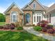 Charming home featuring stone accents, manicured landscaping, and a welcoming entrance at 16160 Hopewell Church Rd, Midland, NC 28107