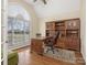 Cozy office with hardwood floors, custom built-ins, and ample natural light, ideal for remote work at 16160 Hopewell Church Rd, Midland, NC 28107