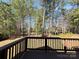 Inviting back deck overlooking a serene, wooded lot, perfect for relaxing and enjoying nature at 16446 Doves Canyon Ln, Charlotte, NC 28278