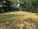 Large backyard featuring a fence, shed, and plenty of space for recreation and landscaping at 1713 Archdale Dr, Charlotte, NC 28210