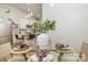 Bright dining room with glass topped table near the kitchen, and a seating for four at 1713 Archdale Dr, Charlotte, NC 28210