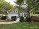 Charming two-story home with brick accents and a welcoming front entrance and mature landscaping at 1713 Archdale Dr, Charlotte, NC 28210