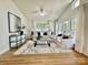 Spacious living room featuring a large windows, hardwood floors, and lots of natural light at 1713 Archdale Dr, Charlotte, NC 28210