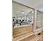 Bright, airy living room with large windows, hardwood floors, and views from the open floorplan at 1713 Archdale Dr, Charlotte, NC 28210