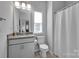 Bathroom with a grey granite vanity, chrome fixtures, and a neutral color scheme at 187 Tetcott St, Mooresville, NC 28115