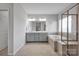 Relaxing bathroom with a double vanity, framed shower door and a large soaking tub at 187 Tetcott St, Mooresville, NC 28115