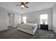 Comfortable bedroom featuring neutral walls, a ceiling fan, and carpeted floors at 187 Tetcott St, Mooresville, NC 28115
