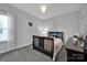 Charming bedroom featuring a dark wood bed frame, a chandelier, and neutral walls at 187 Tetcott St, Mooresville, NC 28115