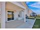 Covered patio with sliding glass doors leading to the interior, offering a comfortable outdoor living space at 187 Tetcott St, Mooresville, NC 28115