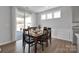 Bright dining area with hardwood floors, a sliding glass door, and modern fixtures at 187 Tetcott St, Mooresville, NC 28115