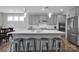 Bright kitchen featuring a large island, stainless steel appliances, and elegant pendant lights at 187 Tetcott St, Mooresville, NC 28115