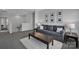 Cozy living area with a gray sofa, and decorative accents, perfect for relaxation at 187 Tetcott St, Mooresville, NC 28115