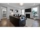 Comfortable living room with modern decor, a fireplace, and plenty of natural light at 187 Tetcott St, Mooresville, NC 28115