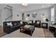 Comfortable living room with modern decor, a fireplace, and plenty of natural light at 187 Tetcott St, Mooresville, NC 28115
