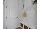 Functional mudroom with bench, storage, and hooks for coats and bags; a great organizational space at 187 Tetcott St, Mooresville, NC 28115
