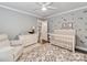 Comfortable Bedroom featuring a changing table, a crib, neutral tones and charming décor at 1916 Pegram St, Charlotte, NC 28205