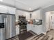 Modern kitchen featuring stainless steel appliances, granite countertops, subway tile backsplash, and white cabinetry at 1916 Pegram St, Charlotte, NC 28205