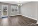 Bright dining area features hardwood floors, chandelier and a sliding glass door to backyard at 1980 Stirewalt Rd, China Grove, NC 28023