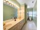 Bathroom with a double sink vanity, linen closet, and separate toilet area at 2217 Blue Bell Ln, Charlotte, NC 28270