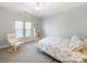 Comfortable bedroom with a soft carpet, natural light from the window, and a relaxed atmosphere for restful nights at 2217 Blue Bell Ln, Charlotte, NC 28270